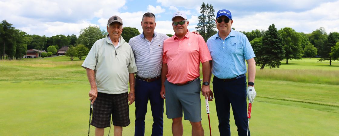 Smiling colleagues at golf course