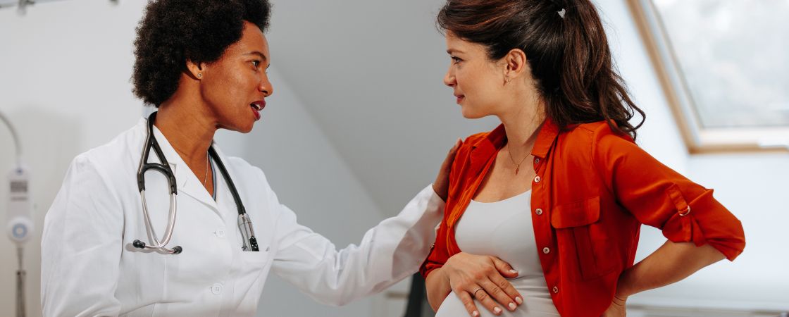 Pregnant patient speaking to doctor