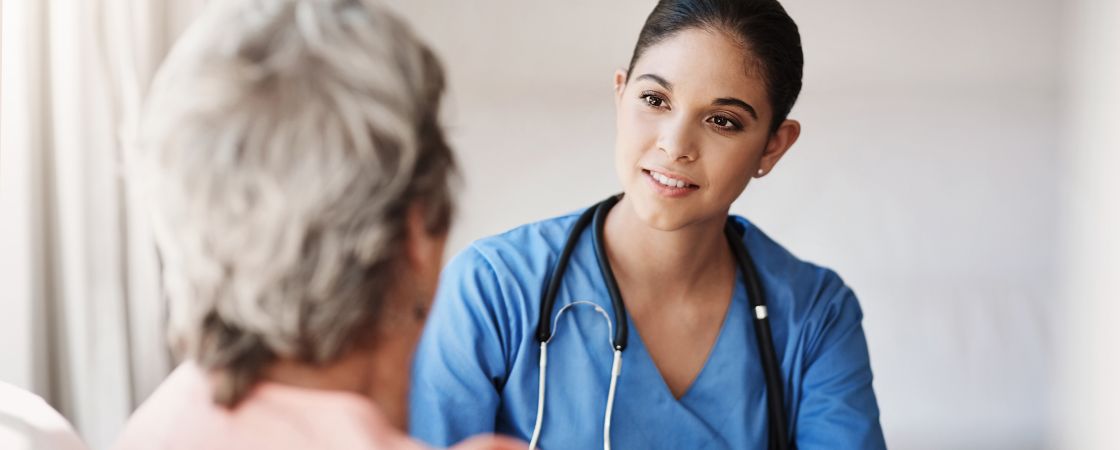 Nurse speaking to patient