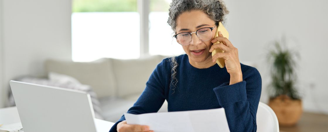 Person making doctor appointment on phone