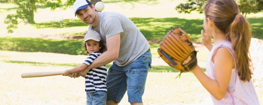 Family playing baseball