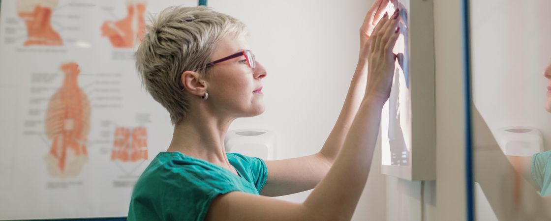 Nurse looking at x-ray