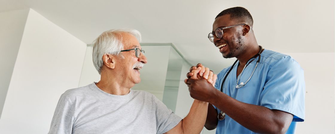 Nurse clasping hand with patient