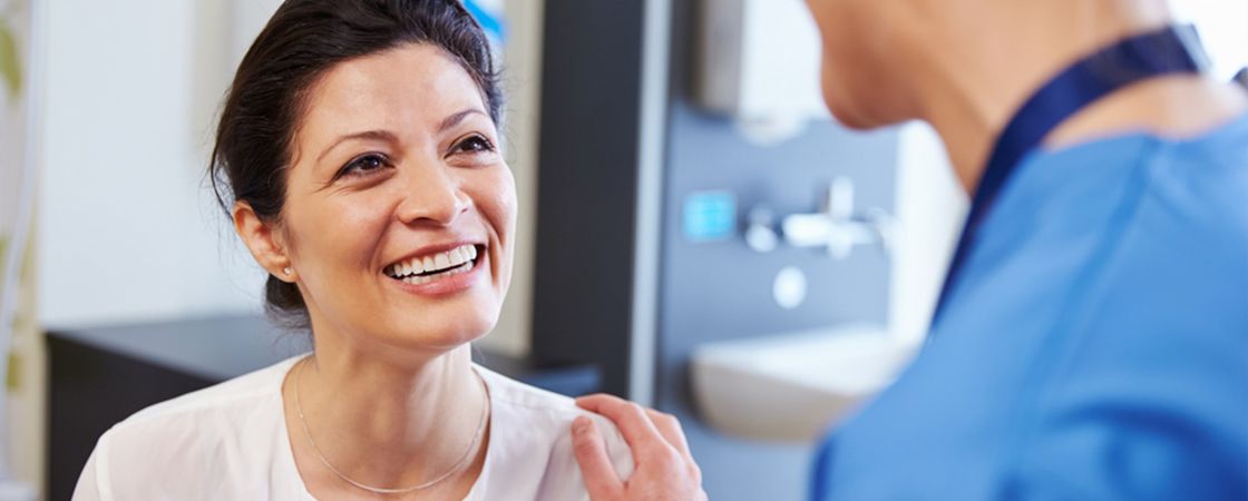 Nurse speaking to patient