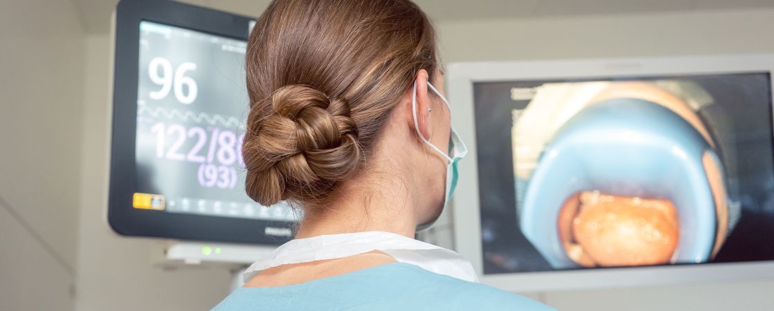 Nurse reviewing Gastroenterology results on screen