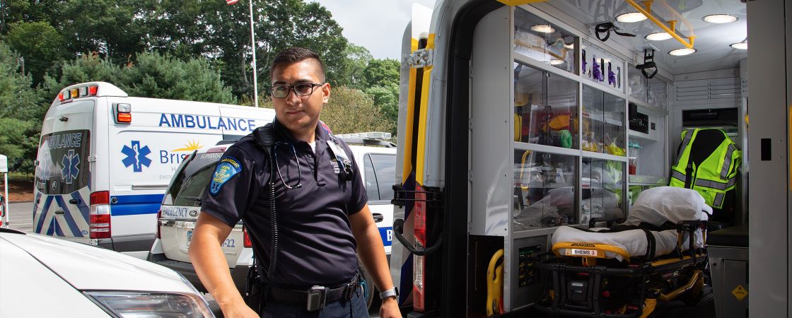 EMT standing in front of ambulance