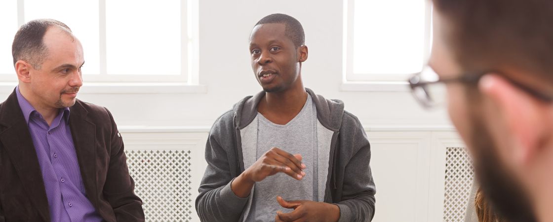 Man speaking at support group