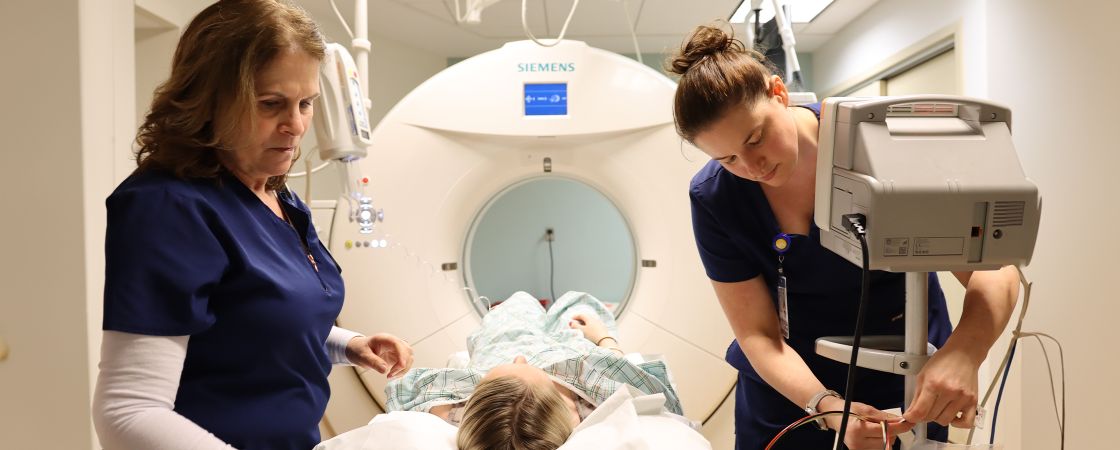 Nurses setting up MRI test on patient