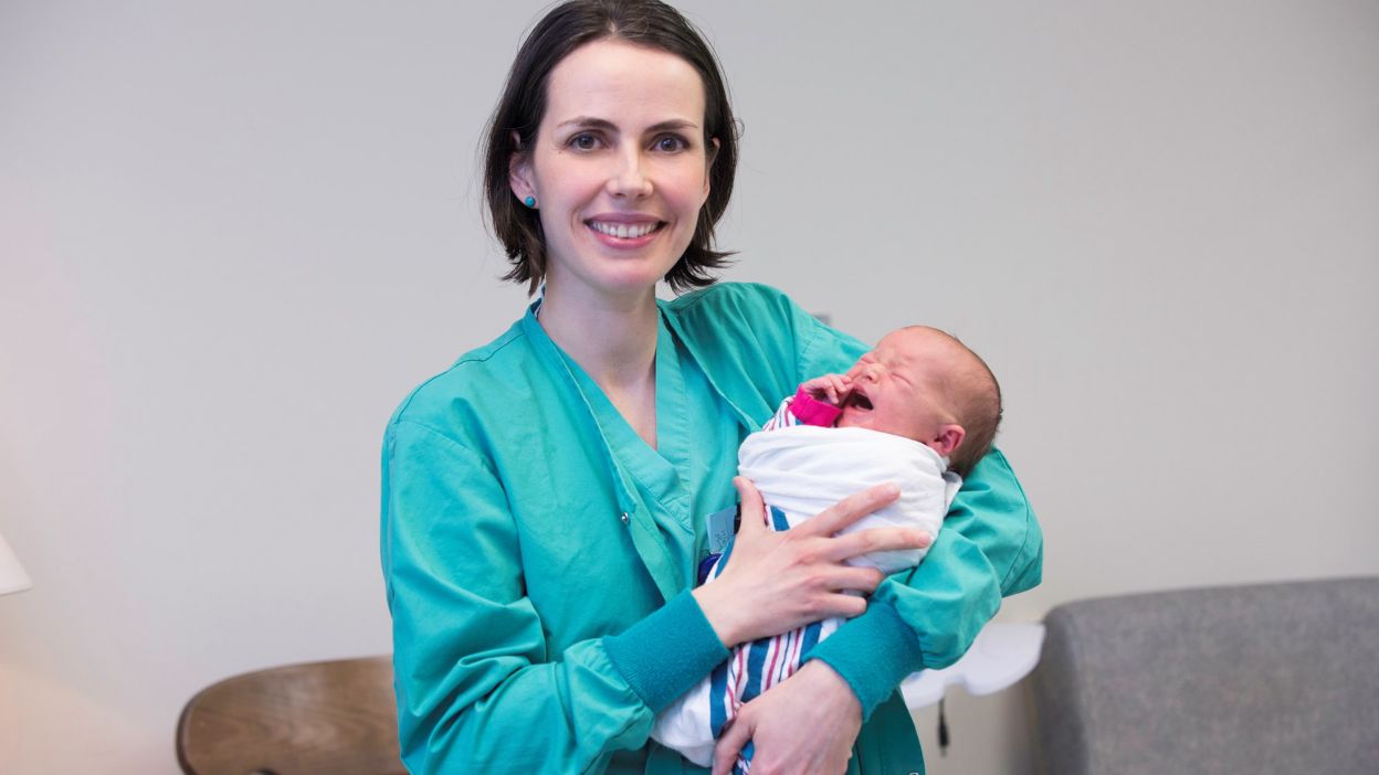 Nurse holding baby