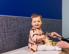 Young baby getting examined with a stethoscope 