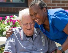 Patient hugging a family member