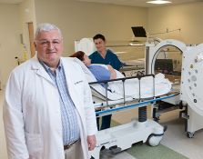 Doctor and nurse preparing woman for hyperbaric chamber