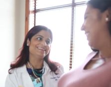 Doctor smiling at patient 