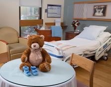 Teddy bear on table in hospital room