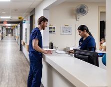 Nurses speaking at desk