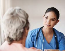 Nurse talking to older patient