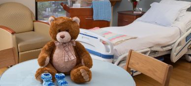 Teddy bear on table in hospital room