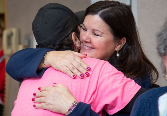 Friend hugging cancer survivor 