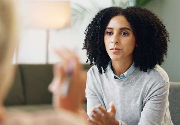 Woman speaking to counselor