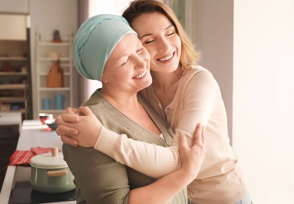 Cancer patient hugging family member