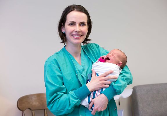 Nurse holding baby