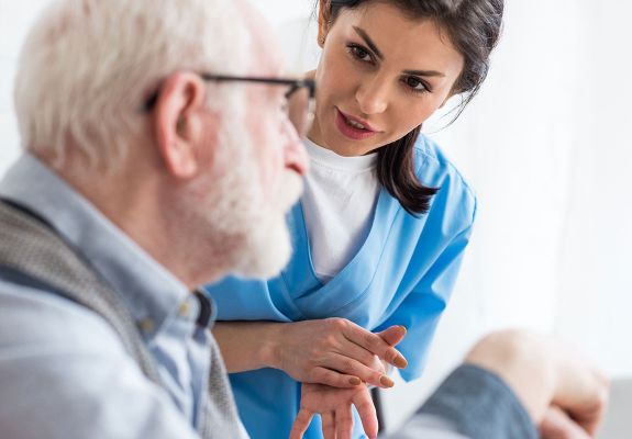 Nurse speaking to patient