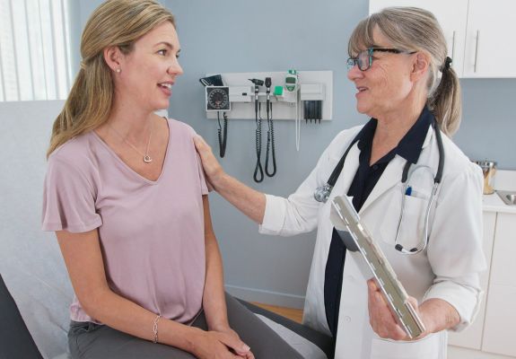 Doctor speaking to patient