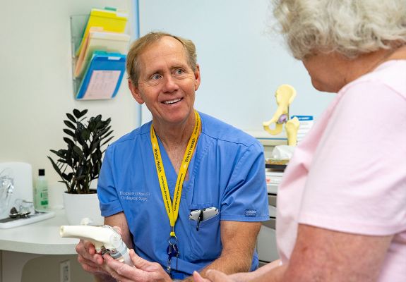 Doctor speaking to patient in exam room