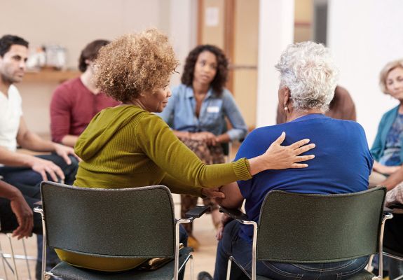 People in sitting in circle at support therapy group 