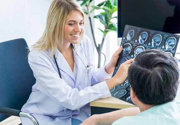 Doctor showing patient xrays