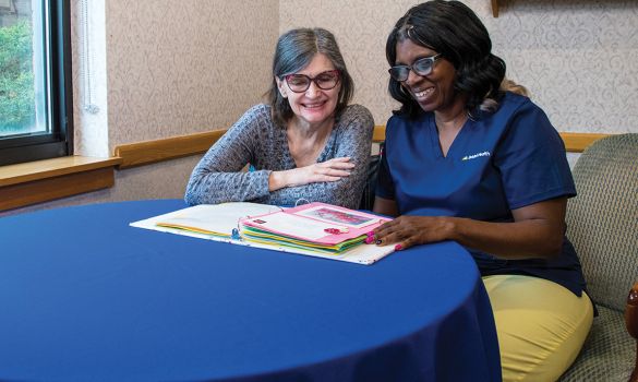 Nurse and patient looking at documents